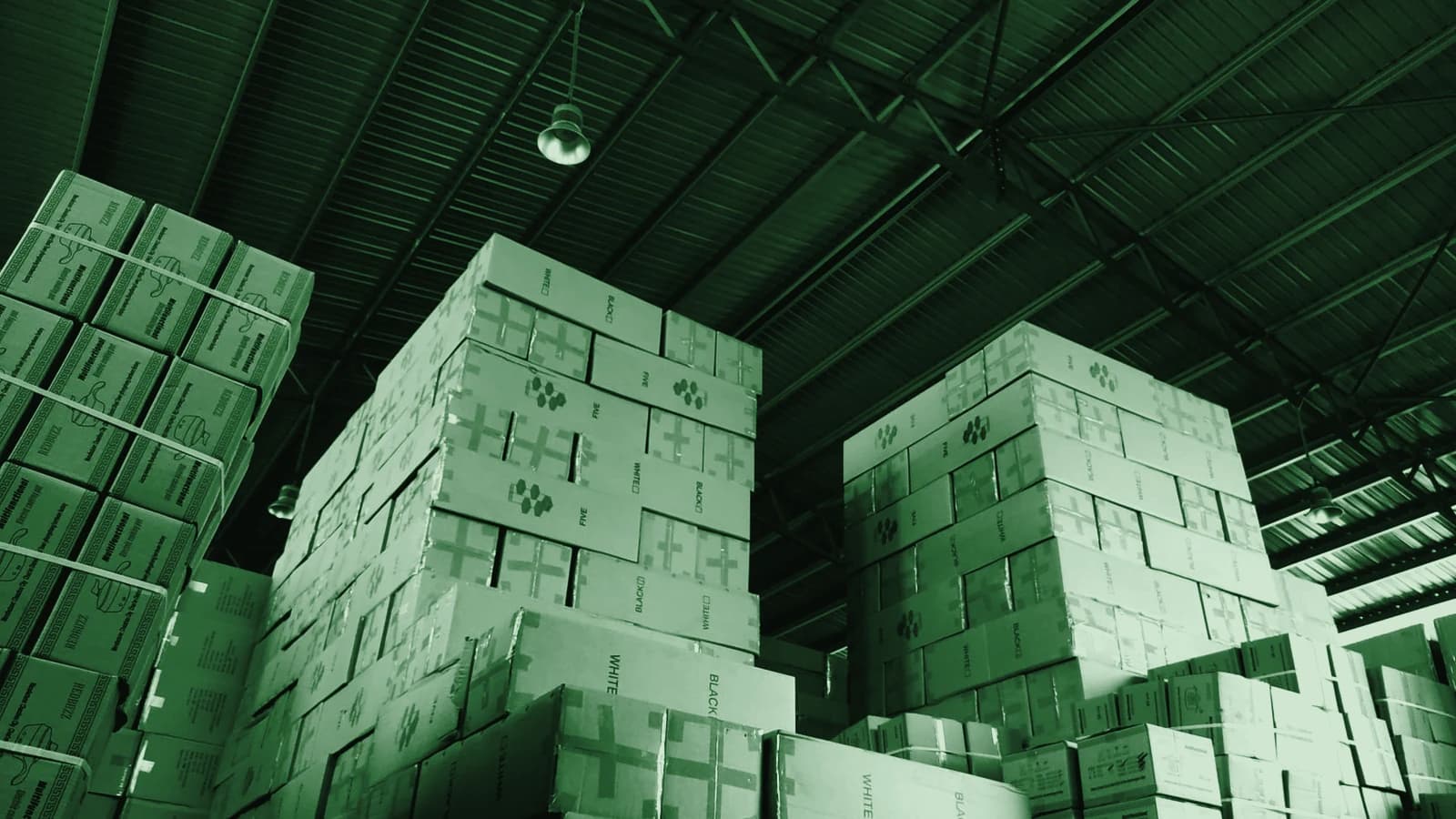Cartons stacked to the roof of a packaging warehouse